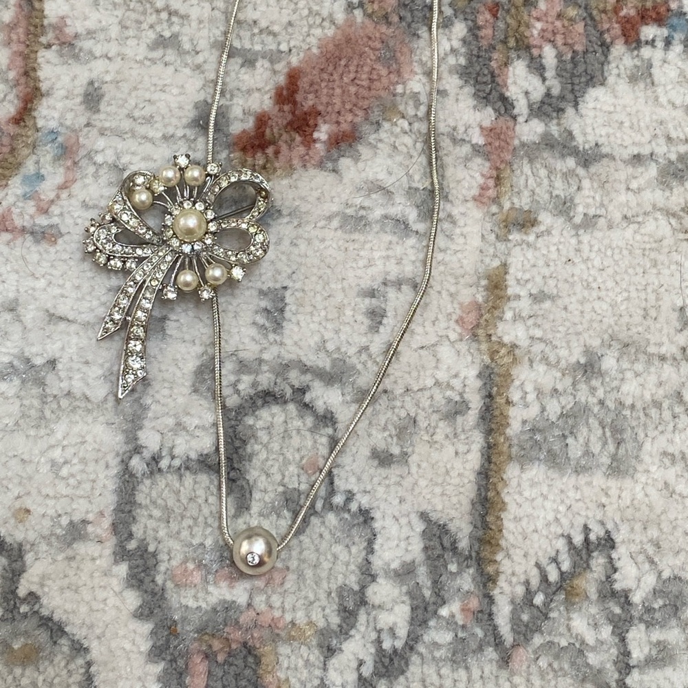 Costume jewelry necklace and brooch